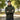 WarriorGear.eu olive green tactical fleece hoodie with reinforced shoulders and velcro patches. Model arms crossed.