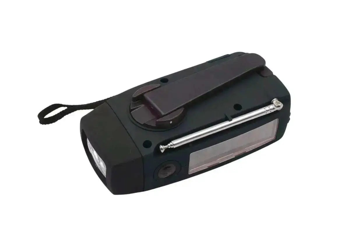 WarriorGear.eu red and black multi-function emergency radio with hand crank, solar panel, LED flashlight, and AM/FM tuner.
