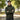 WarriorGear.eu olive green tactical fleece hoodie with reinforced shoulders and velcro patches. Model arms crossed.