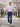 WarriorGear.eu men's blue stretch denim tactical jeans with reinforced knees and multiple pockets, worn by a model walking outdoors.